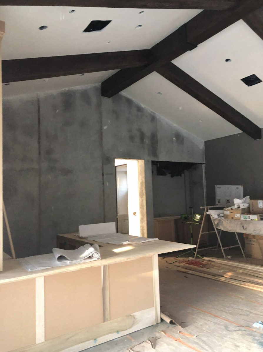 Spanish Ranch ADU interior under construction showing installed timber trusses