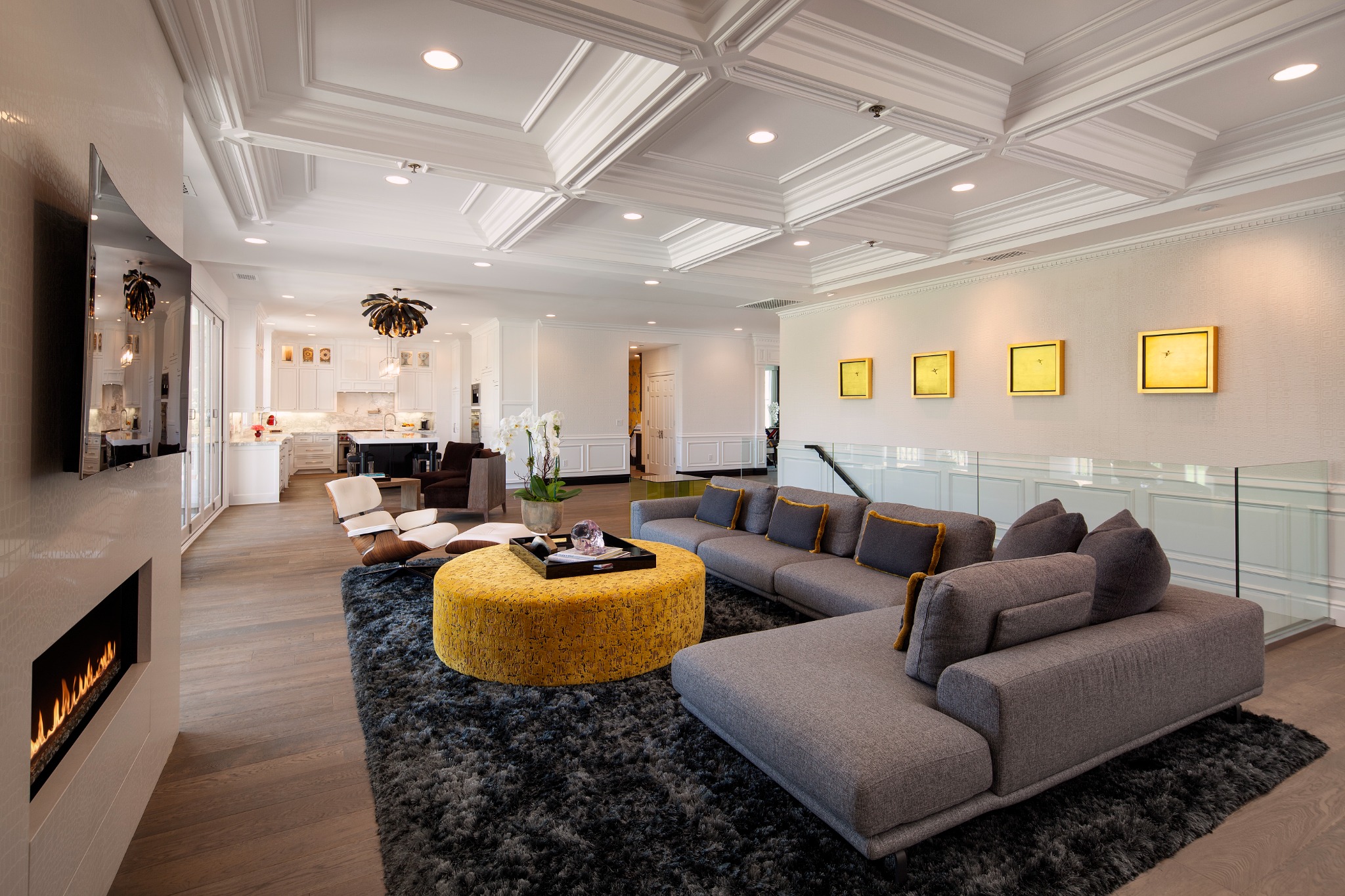 Garden Estate living room with coffered ceiling, glass guardrail, fireplace, and coordinated furnishings
