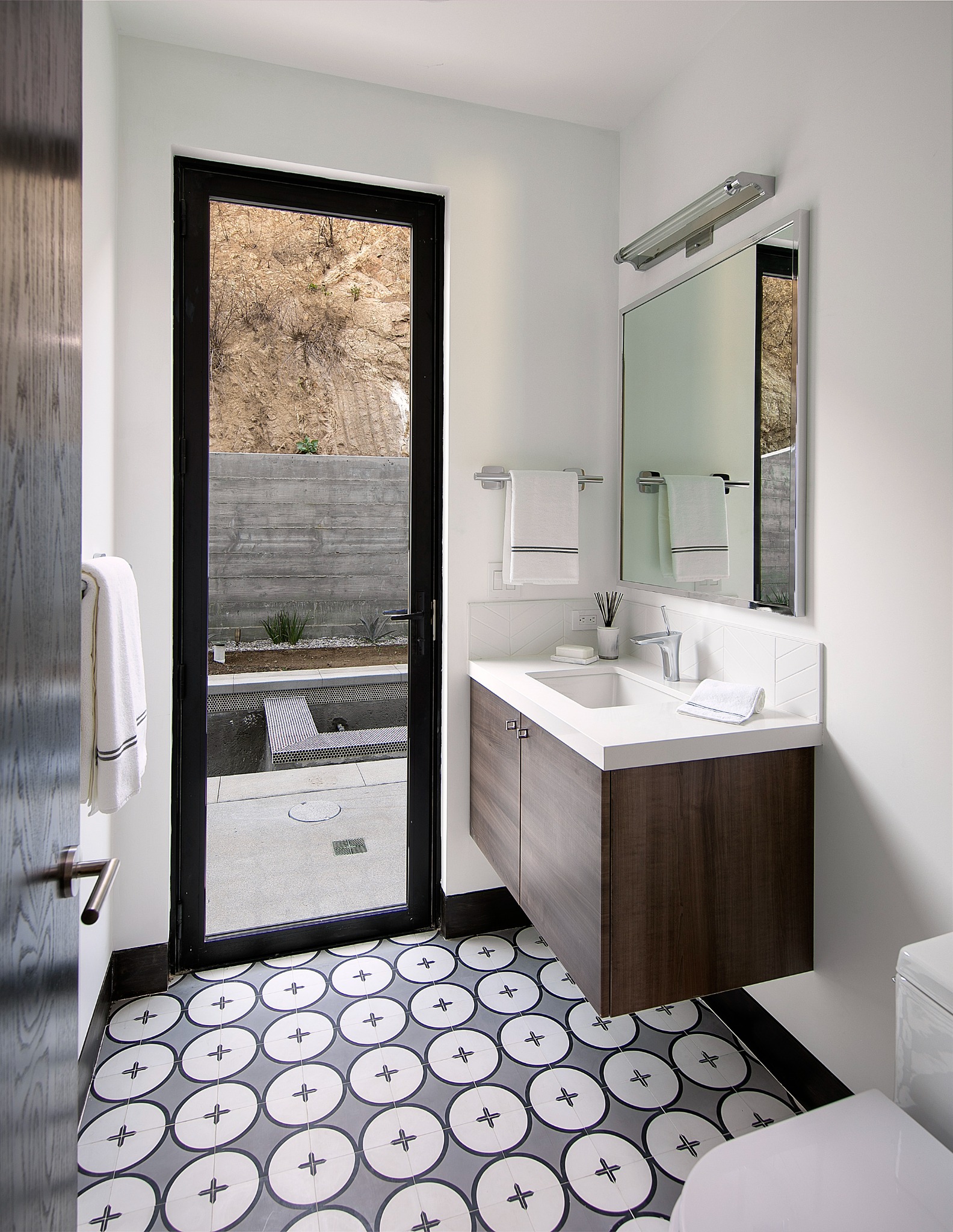 Sunset Plaza bathroom with circular patterned floor