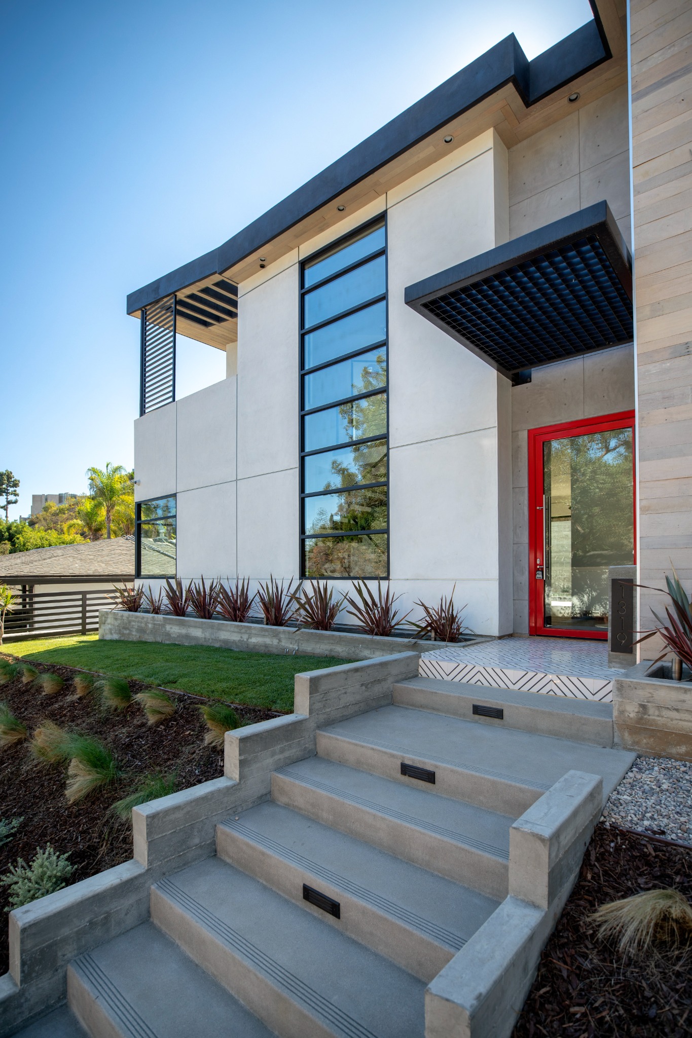 Sunset Plaza red entry door and concrete stair detail